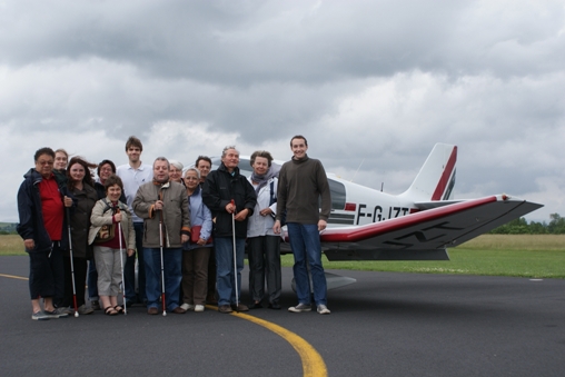 personnes ayant fait un baptme de l'air avec le moniteur et vue de l'avion